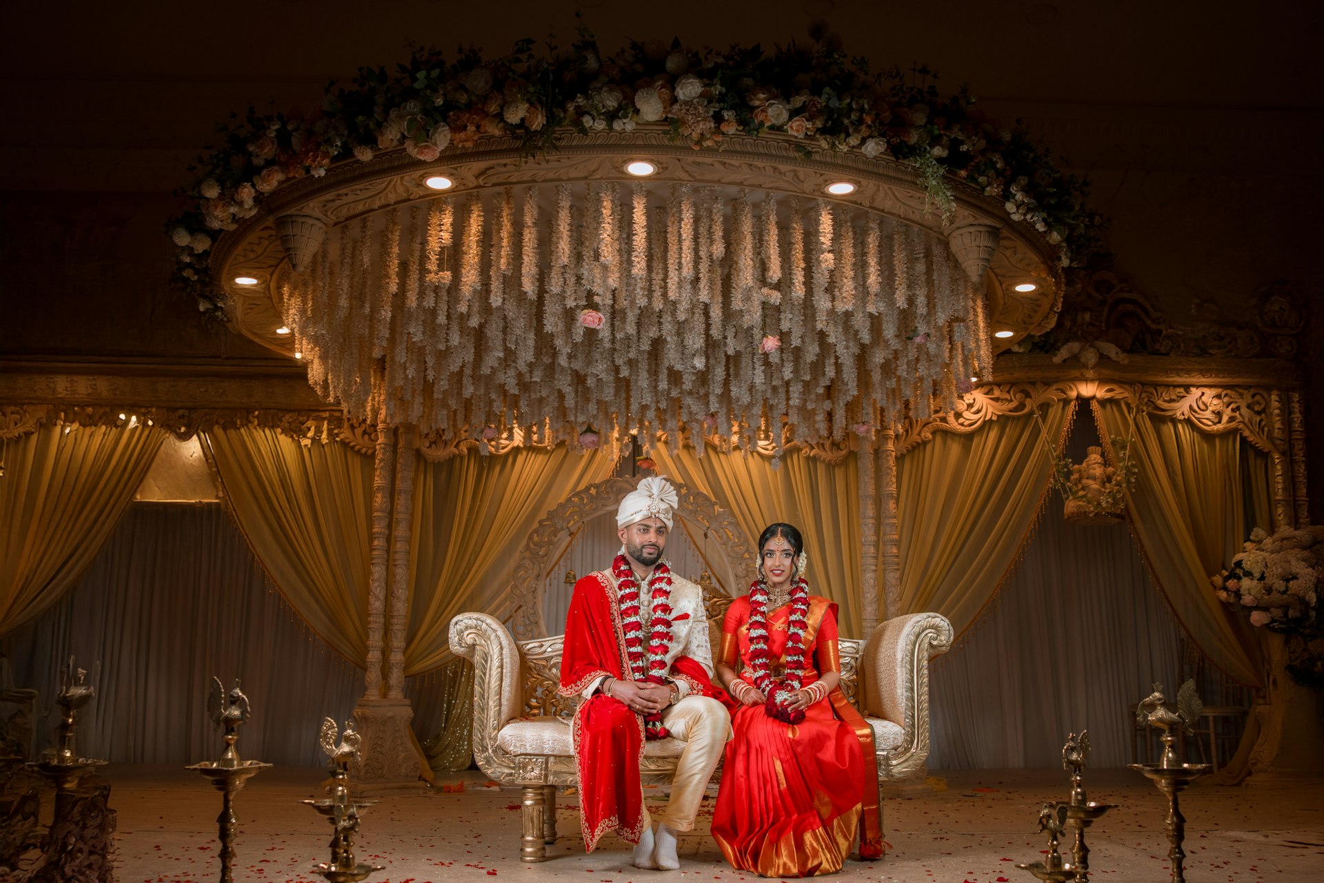 A couple is posing for their wedding photo.